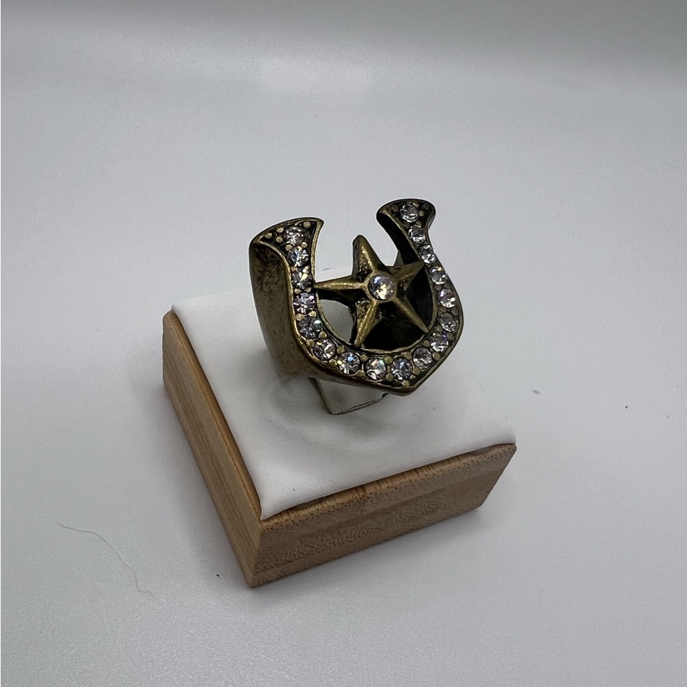 Gold Horseshoe Ring with Intricate Detailing